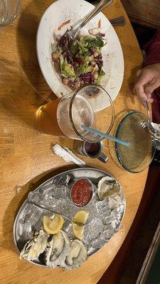 Oysters in the half shell and salad.