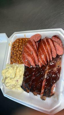 2 meat Combo Plate including Ribs and Sausage with Brisket baked beans and Homemade Potato salad