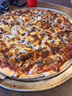 Large sausage and mushroom pizza.