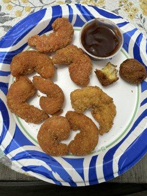 Chicago shrimp; seasoned with garlic.  The light shrimp is regular.  Hush puppies