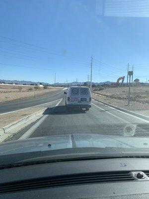 Me snapping a picture of his car to get the number right before he blocked us from getting on the freeway