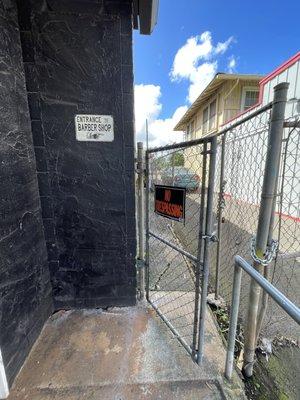 Entrance between rising tide tattoo and old town pizza.