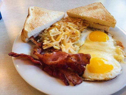 Early Bird with over easy eggs, bacon, toast and hash browns.