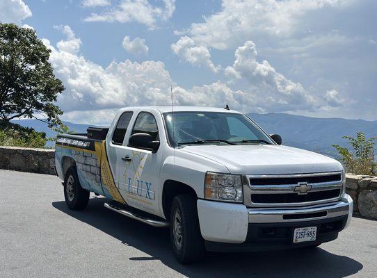 Lux foundation solution truck working on skyline dr repairing stone walls