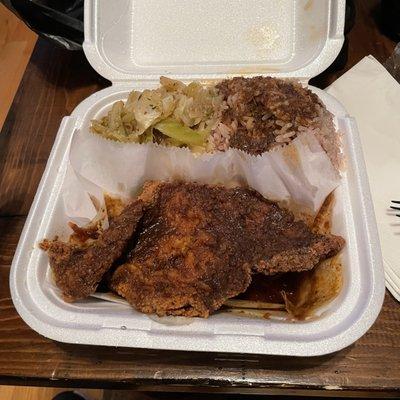 Jerk fried catfish, rice and peas with the sauce sprinkle and cabbage