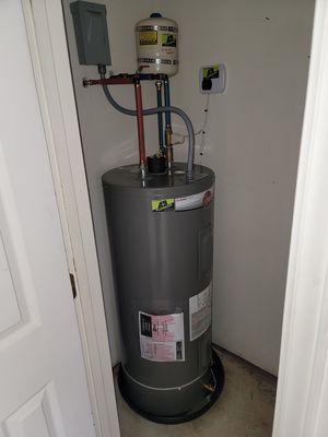 New electric water heater with leak detection and automatic emergency water shutoff.