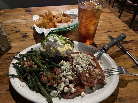 Had this just the other night. 2 bacon wrapped pork chops with blue cheese crumbles, green beans and baked potato.