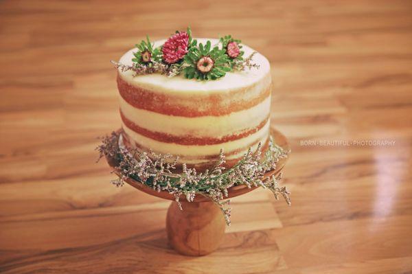 Naked cake with wildflowers