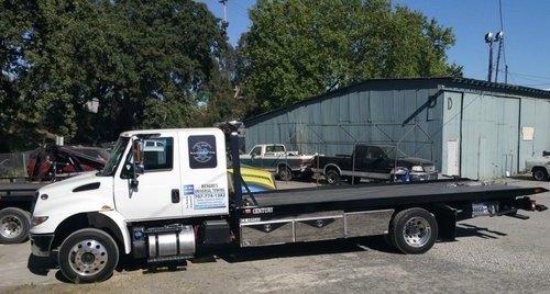 Richard's Universal Towing Flat Bed Truck.