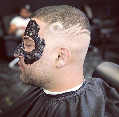 Mid skin fade with design