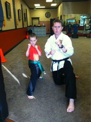 My 8yr old green belt son with sensei Andrew. He's a great instructor!