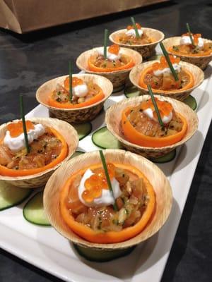 Salmon tartar in tangerine cups