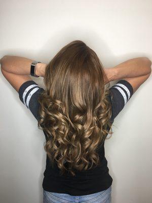 Beautiful layered haircut with soft touchable curls