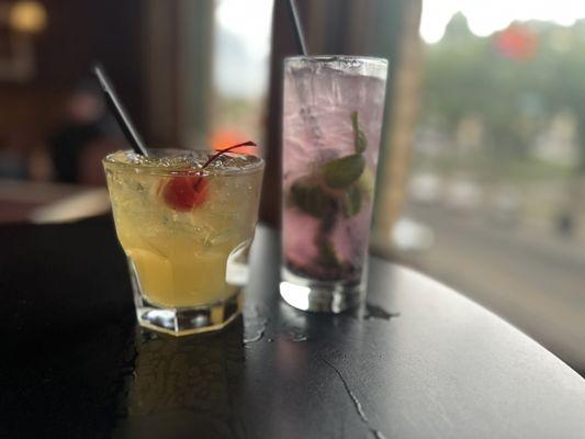 Enjoying a blueberry mojito and a whisky sour as we look out the window at the courthouse.