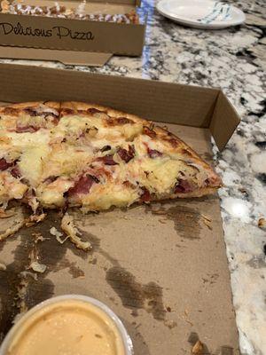 Thin crust Reuben pizza