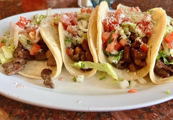 Soft Corn Tortillas, Pulled Chicken with Onion Cilantro, Lettuce, Tomato & Cotija Cheese