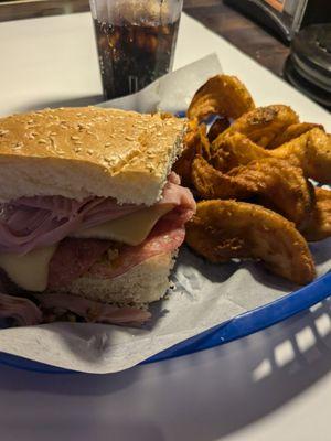 Muffaletta with cajun fries