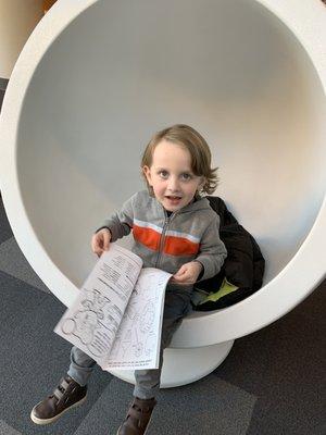 Grady in one of the many kids reading pods.