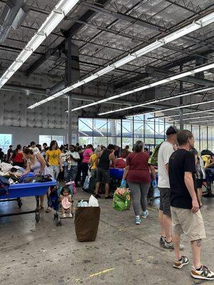 Fresh bins placed and the crowds attack while others wait for new bins