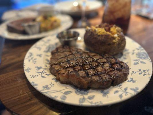 Ribeye with loaded baked potato