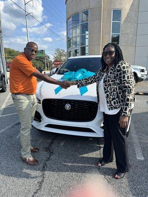 Deborah Wilson shaking hands with Salesman Ryan Wilson, after I purchased the 2023 F Pace Jaquar. We are not related.