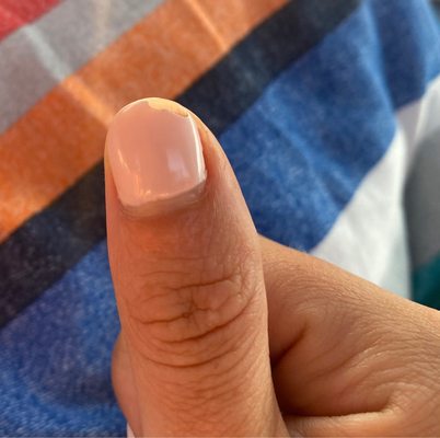 Chipped gel nail after 1 day, uneven paint, far from cuticle line.