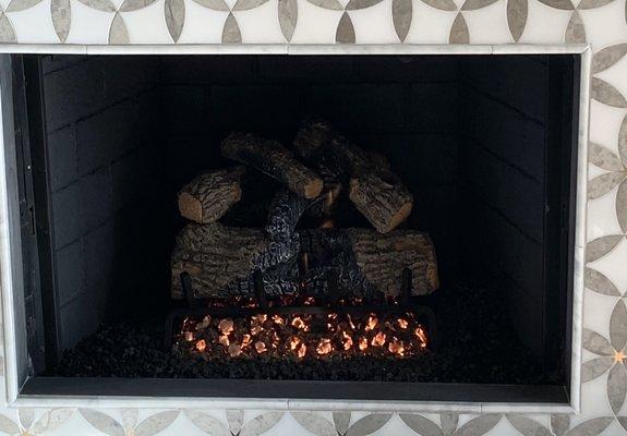 Restored Fireplace/ inside painted black, new logs and lavaf