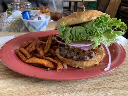 Cluckin' burger and sweet potato fries with homemade maple sauce