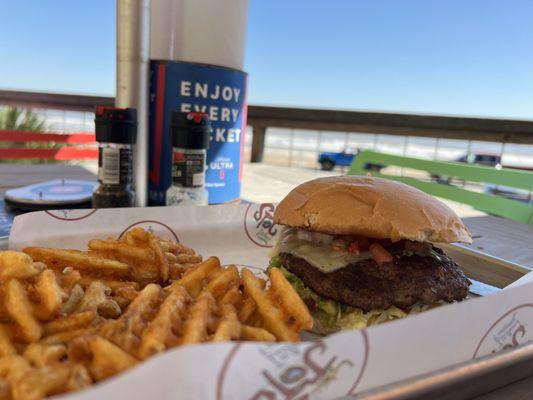 Burger with pepper jack cheese, salsa, and fries.