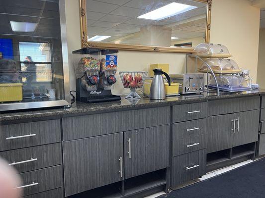 These are photos of the breakfast area, which is located in the lobby of the motel.