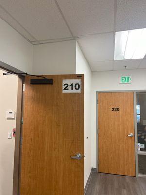 The door has a visible 210 to help direct patients to our office on the second floor of the 365 building.