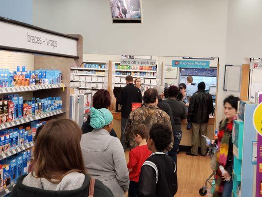 Long lines at Walgreens in Aubrey at 4 PM. I came inside because of the long drive thru line that had several cars in line.