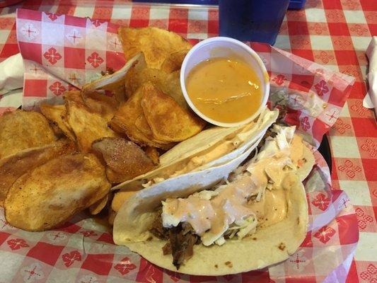 Pork and brisket tacos (no cilantro) with chippers.