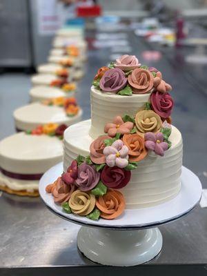 Two tier cake with buttercream rose cascade.