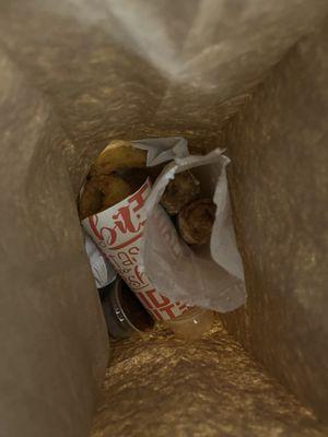 Food at the bottom of a brown lunch bag