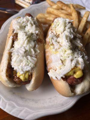 Hot dogs with chili, mustard, and slaw