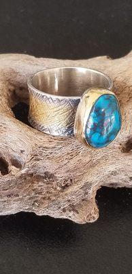 Bisbee high grade turquoise in silver and 22 it gold.