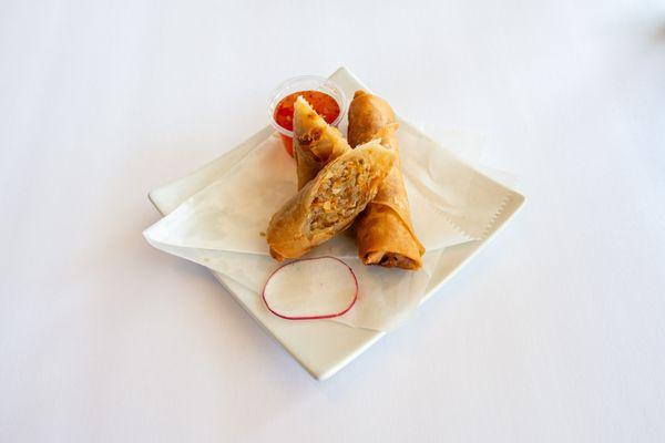 Golden fried rolls that was wrapped in flour paper with pork and veggies.