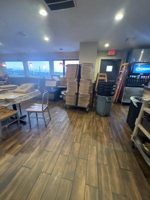 This is inside the restaurant.  A ladder, stacks of boxes, stacks of trash cans. Just crazy.