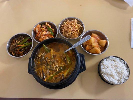 Yukgaejang. The best Korean spicy beef soup love it, literally my favorite dish here. I love all the sides it comes with!