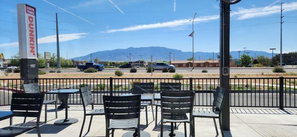 View of the outside patio and Sandia Mountains out the front windows.