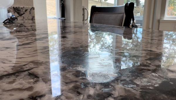 Large acrylic fill in the middle of the countertop. Looked terrible.