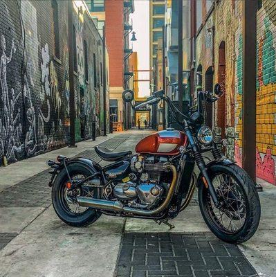 A Triumph Bobber striking a pose in Boise's Freak Alley