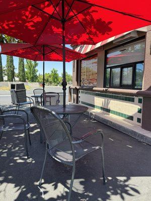 Outside seating by menu. Other side from drive thru window.