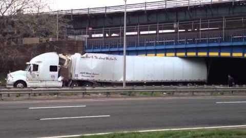 Truck meets bridge on the Hutch under Westchester Ave in the Bronx.  It's painted blue with yellow stripes and he still hit it.