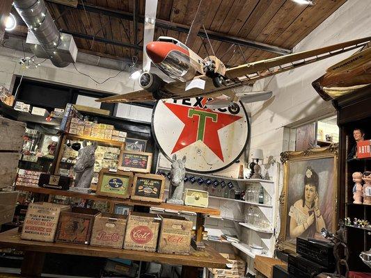 Vintage model plane and Texaco Sign