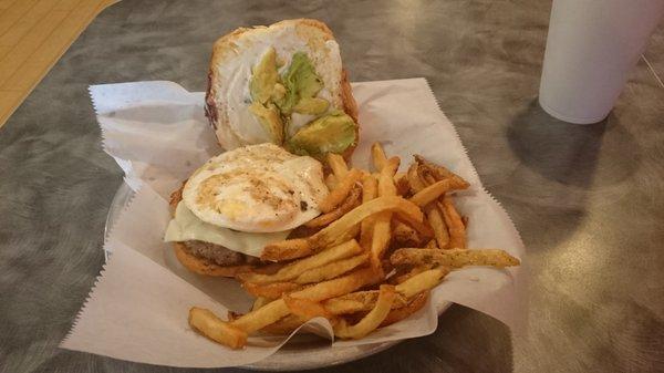 Brazilian burger and fries.  Wonderful beef patty, Swiss cheese, bacon, fried egg, and avocado with mayo on a lightly toasted bun.  YUM!!