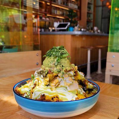 Nachos Chorizo, fermented black beans, Turmeric queso funding, sour cream plant-based