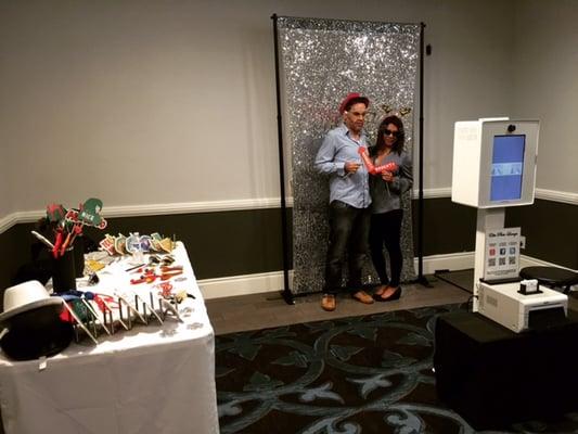 Open view photo lounge setup featuring our White Elite Photo Tower and silver sequins backdrop