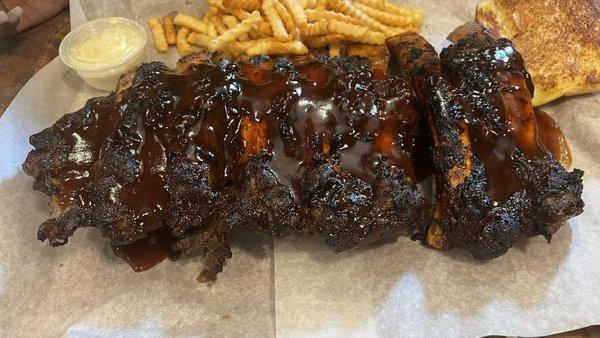 Full slab of barbecue beef ribs dinner